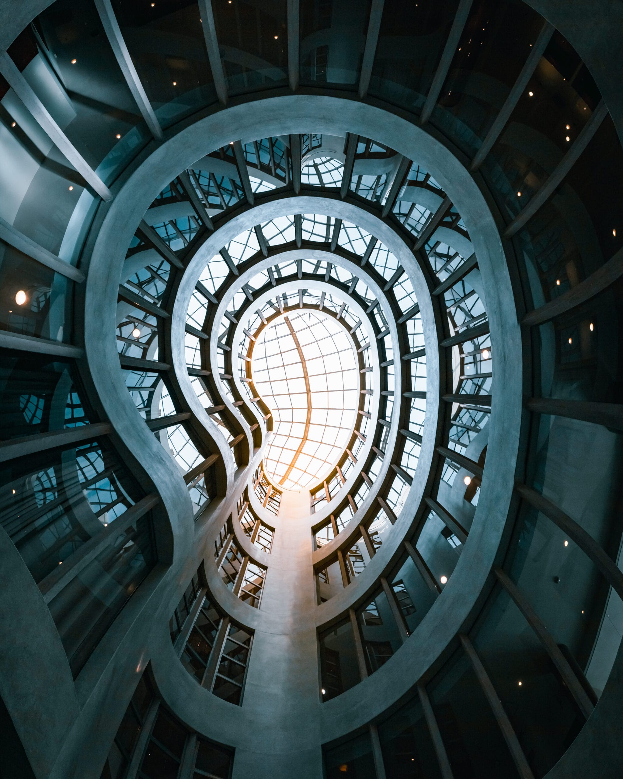 Low angle inside a modern building with geometrical walls and dome